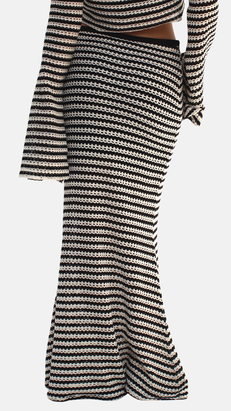 Black and white striped skirt on a white background